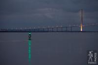 Green buoy and Normandy bridge