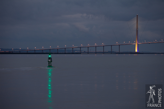 Green buoy and Normandy bridge