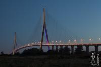 Normandy bridge lit in blue