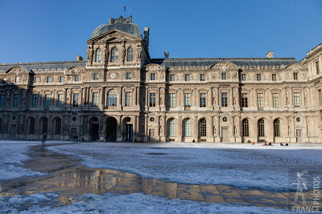 Louvre inner courtyard in snow